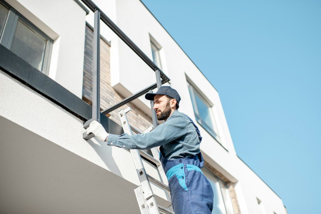 Builder mounting balcony fence